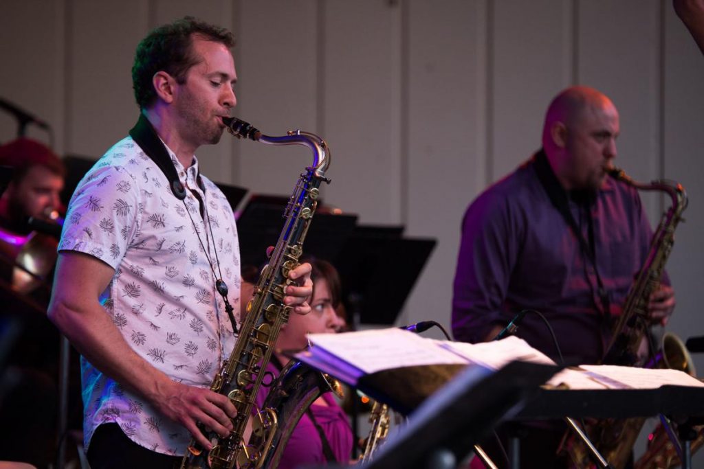 Saxophone players of the Milwaukee Jazz Orchestra perform a kind of "duel."
